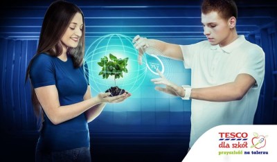 Teen boy holds his thumb up